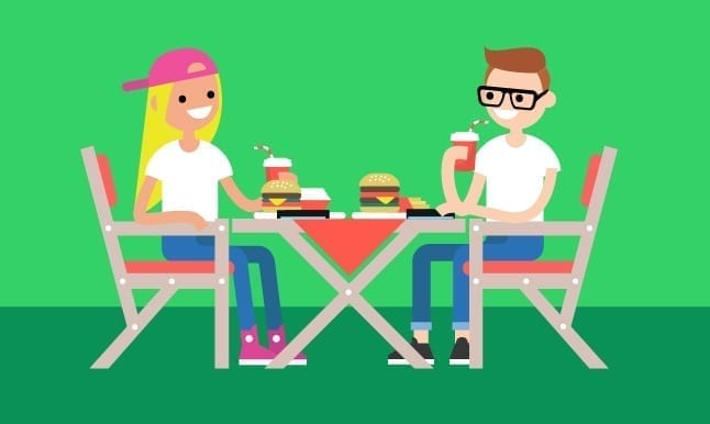 image of a couple setting their phones down and enjoying lunch with each other